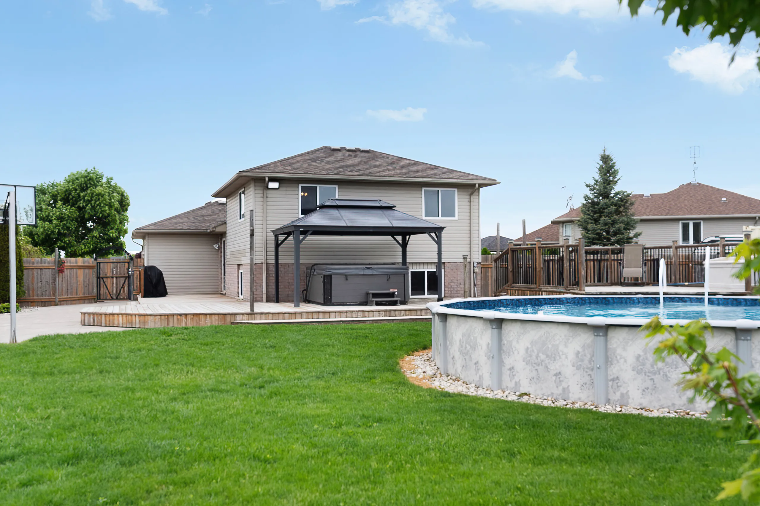 Backyard pool and greenspace at 67 Azar Avenue Tilbury Ontario