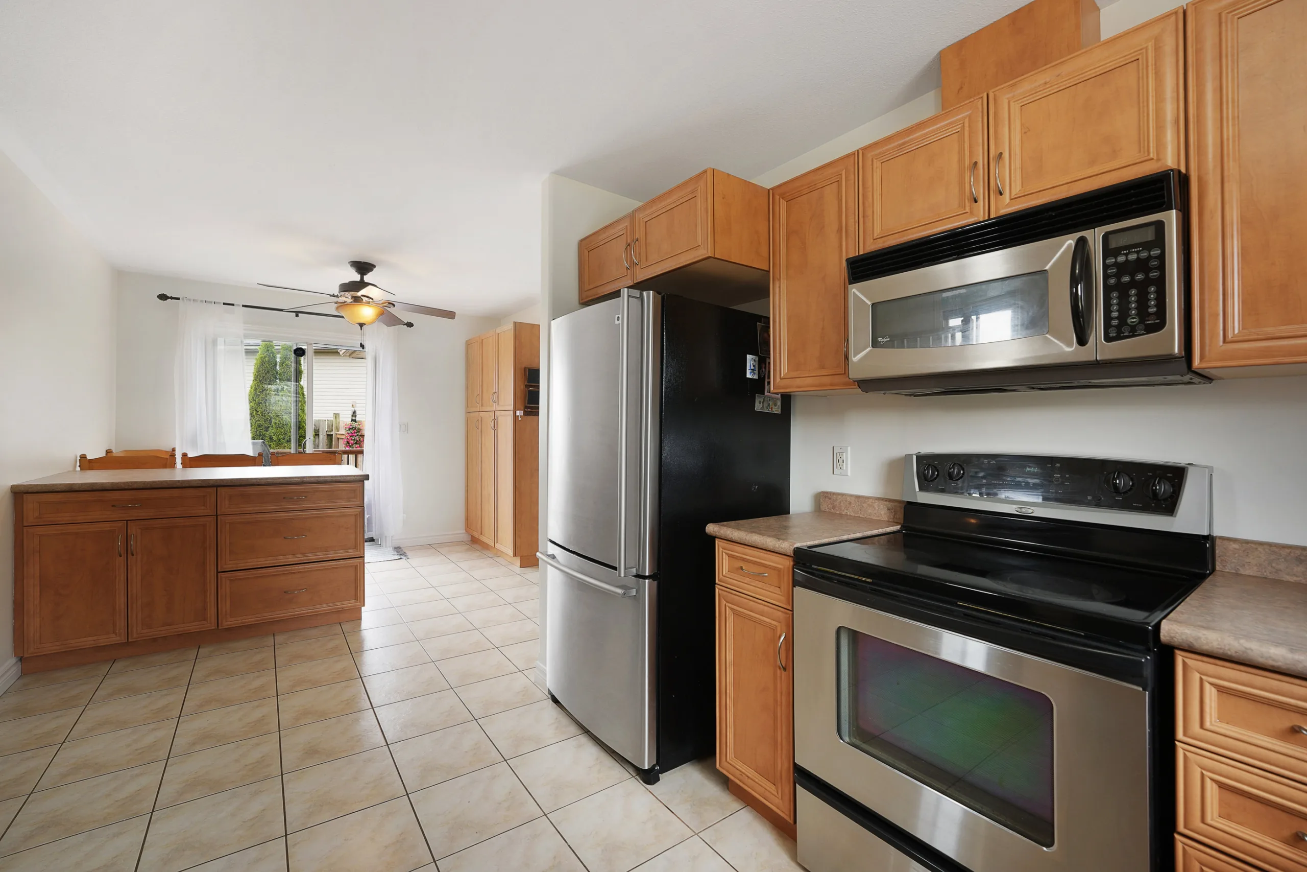 Kitchen and island eating area at 67 Azar Avenue Tilbury Ontario