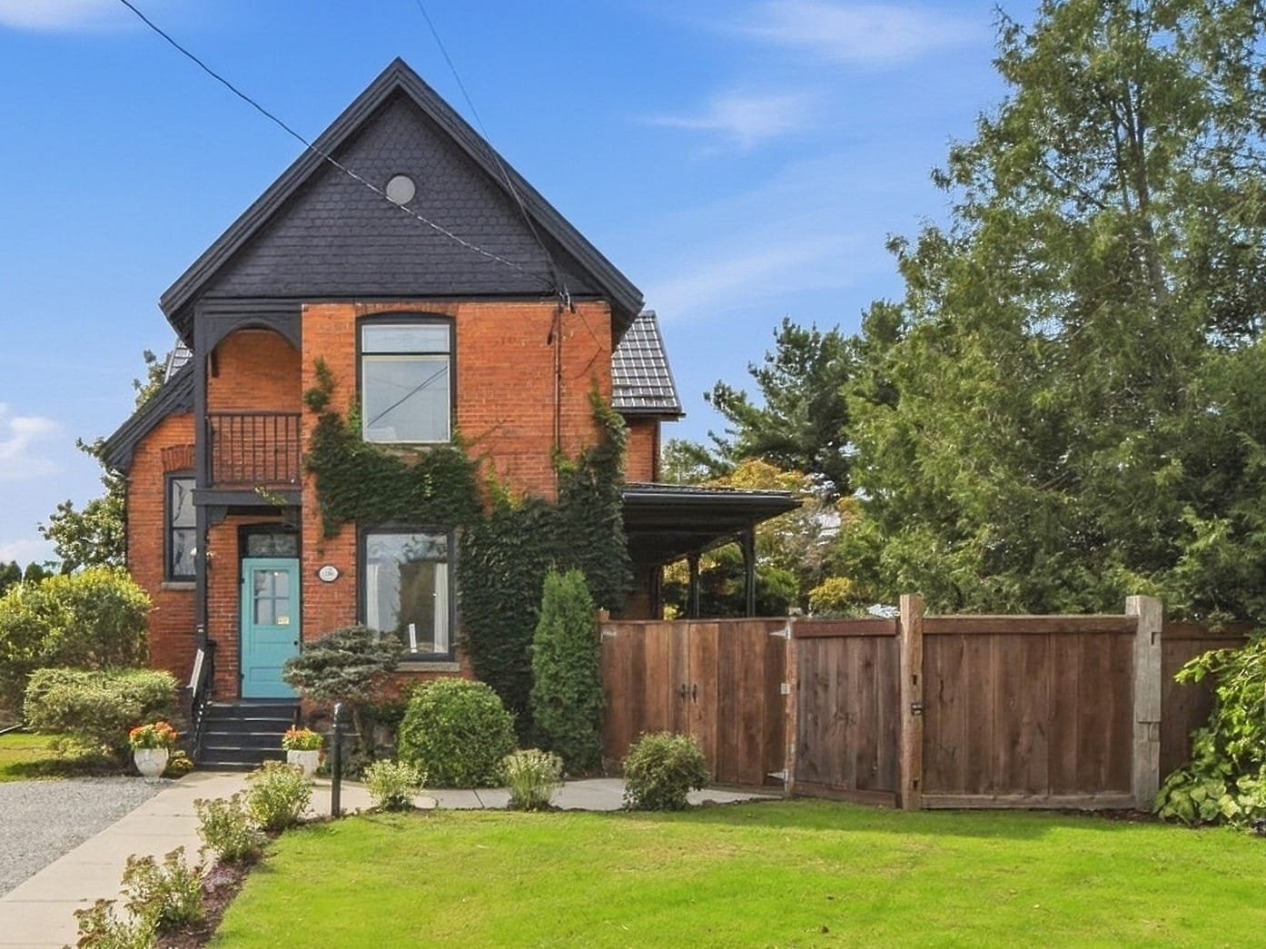 136 King Street South, Highgate Ontario, a terracotta brick Queen Anne Victorian on a double lot