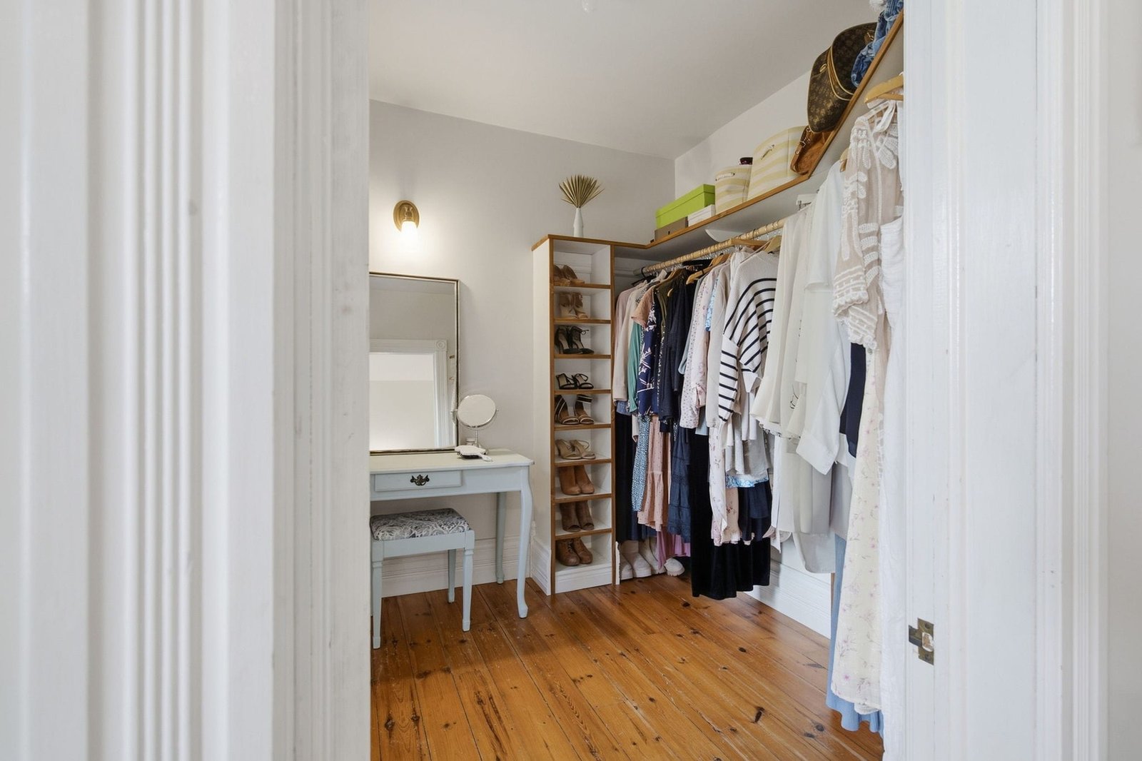 Walk in closet and dressing area with built in shelving