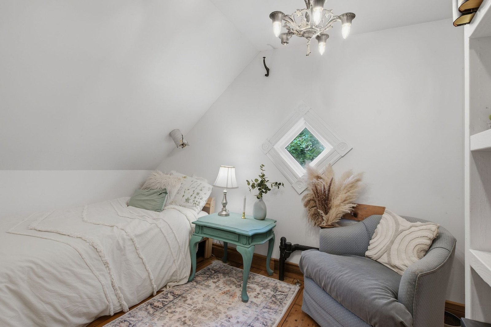 Bedroom with sloped ceiling and reading chair