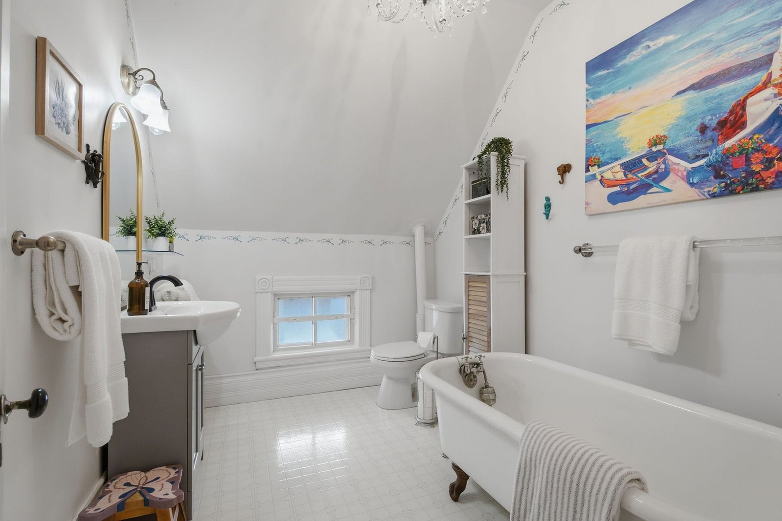 Bathroom with clawfoot tub and vaulted ceiling