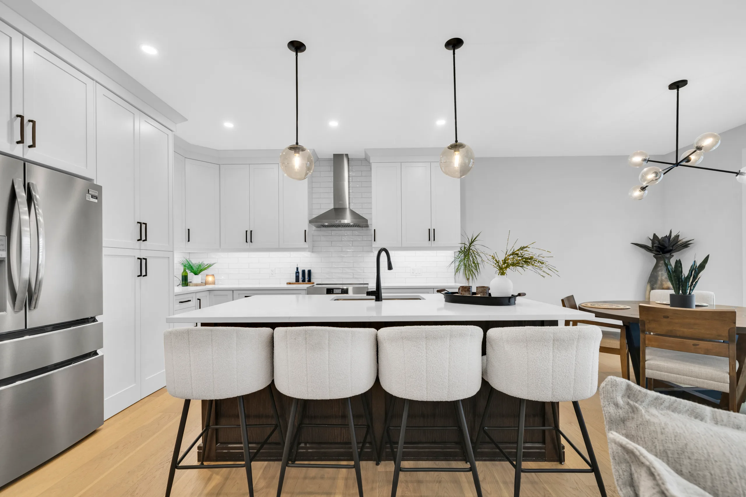 Kitchen with quartz counters and hidden walk in pantry