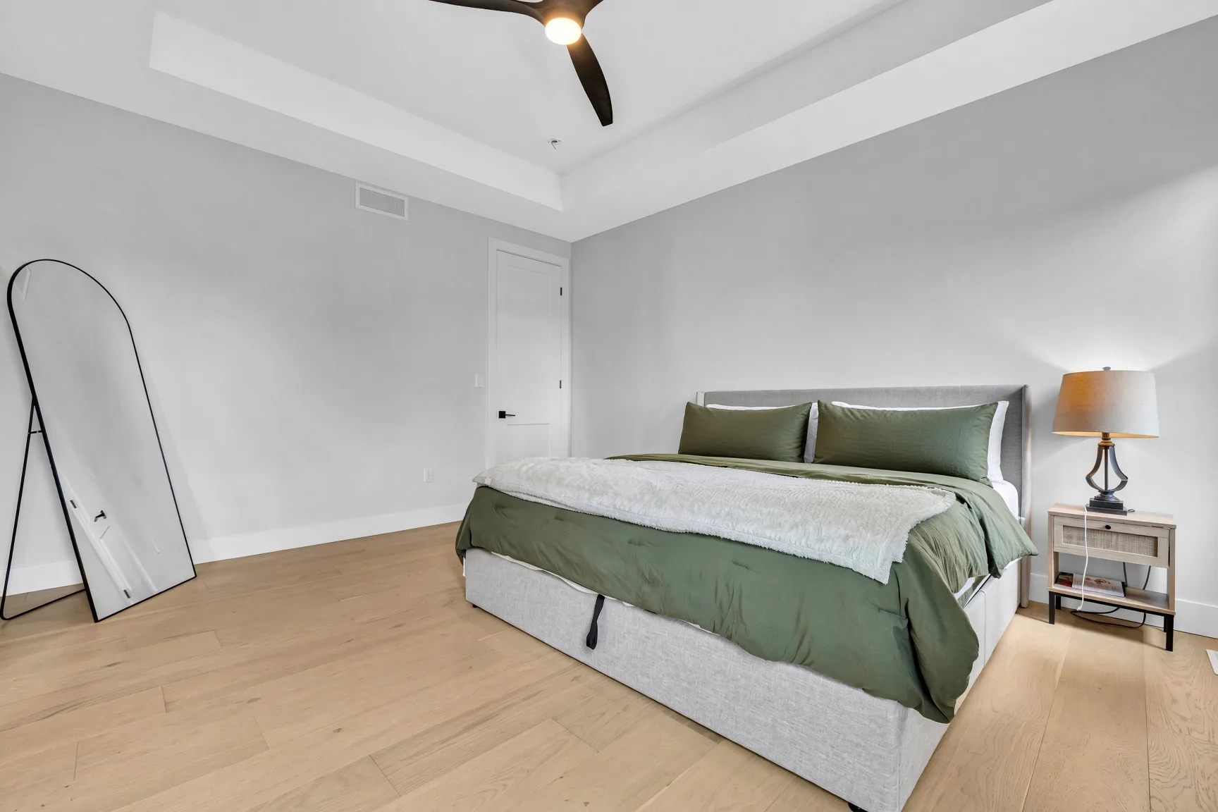 Primary bedroom with tray ceiling